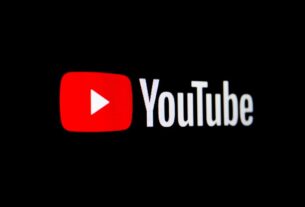 YouTube logo illuminated on dark black background