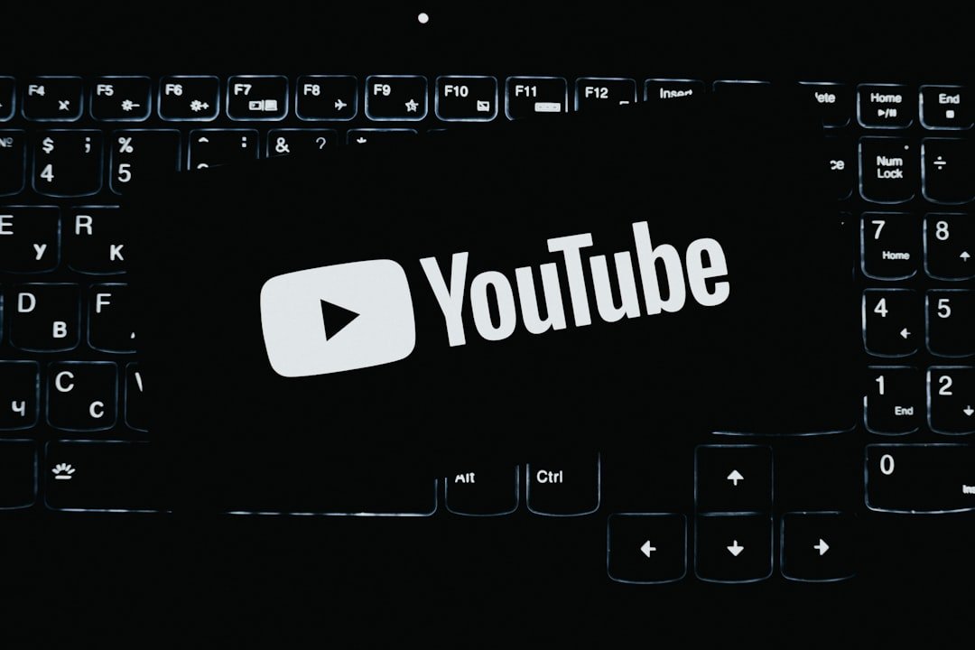 YouTube logo illuminated on dark keyboard keys